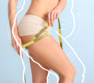 Close up of a woman measuring her thighs with a silhouette of a larger body to signify her weight loss.