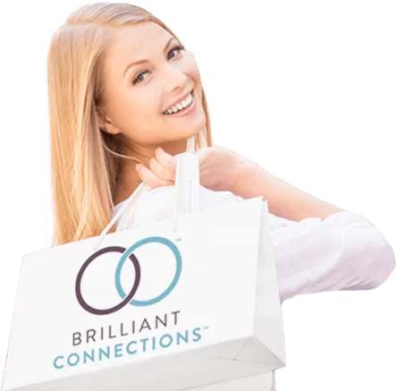 A smiling woman holding a SkinMedica shopping bag